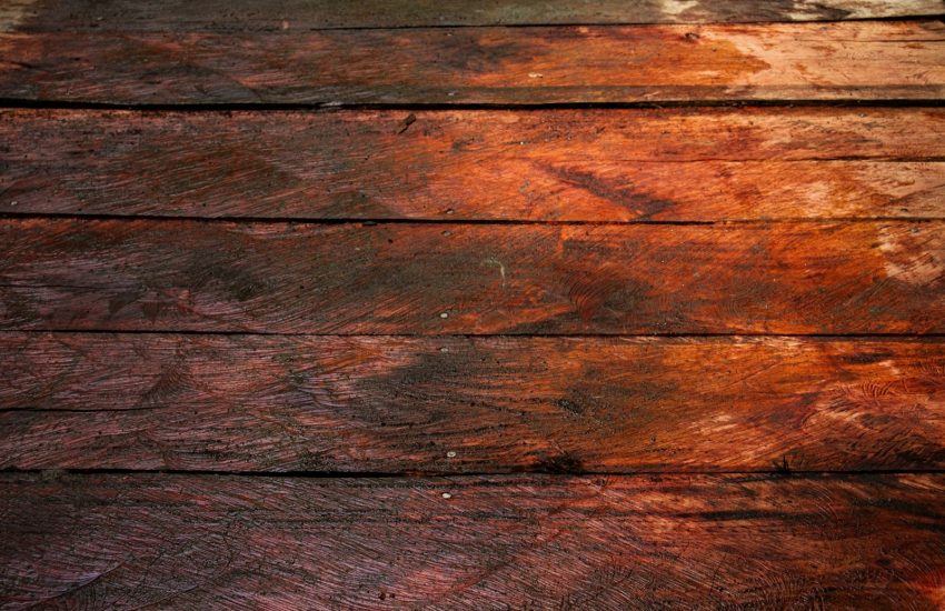 a close up of a piece of wood with peeling paint